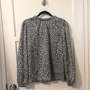 Brand new, long-sleeve animal print blouse,tie in the back neck. Size:M